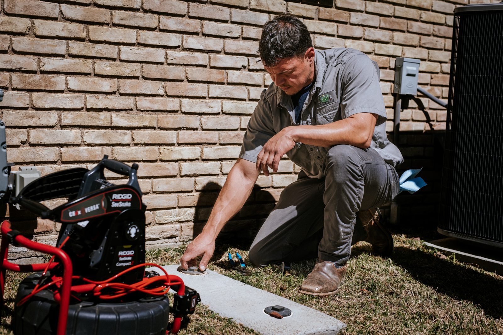 Tioga Plumbing technician pinpointing a slab leak with electronic leak-detection equipment in Hurst, TX