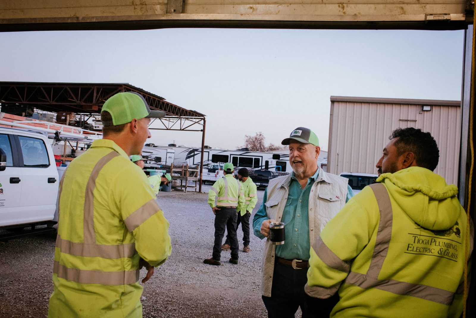 Tioga Plumbing crew catching up in the yard before heading out across DFW