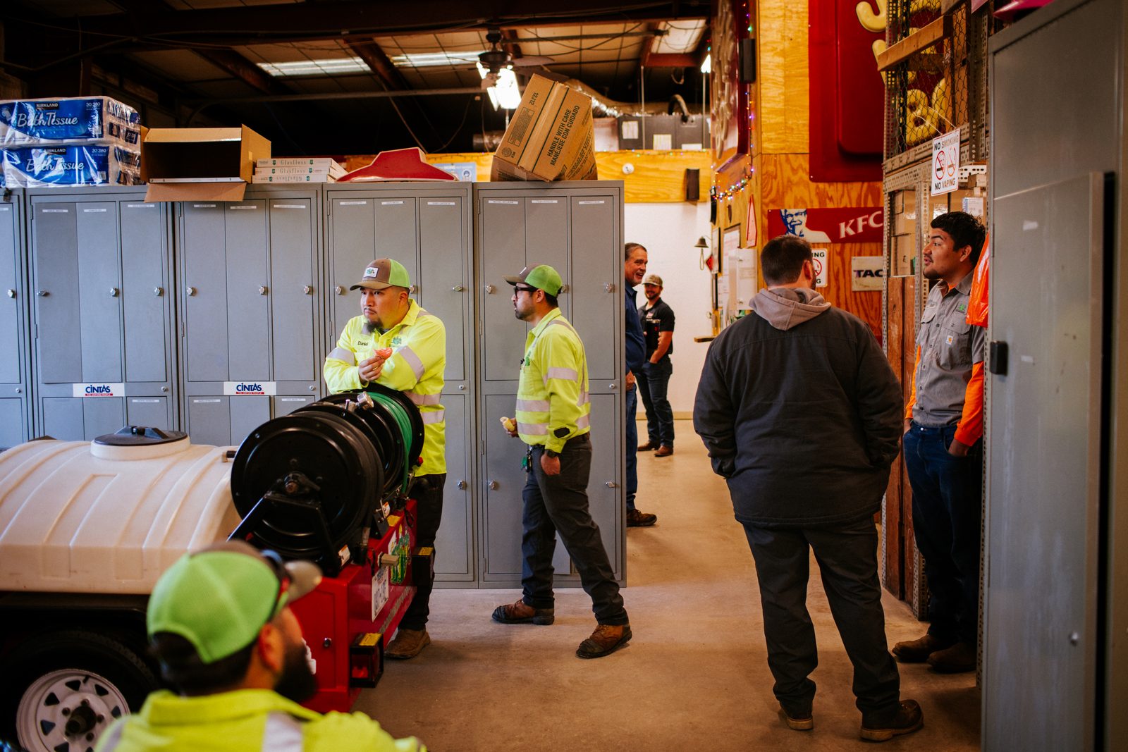 Tioga Plumbing technicians at the warehouse lockers getting ready for the day