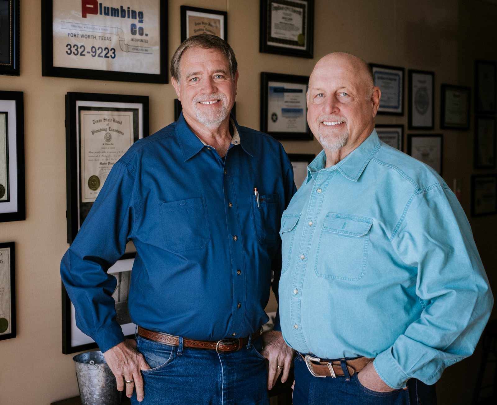 Tioga Plumbing ownership in the Hurst office beneath the family's original Carter Plumbing licenses