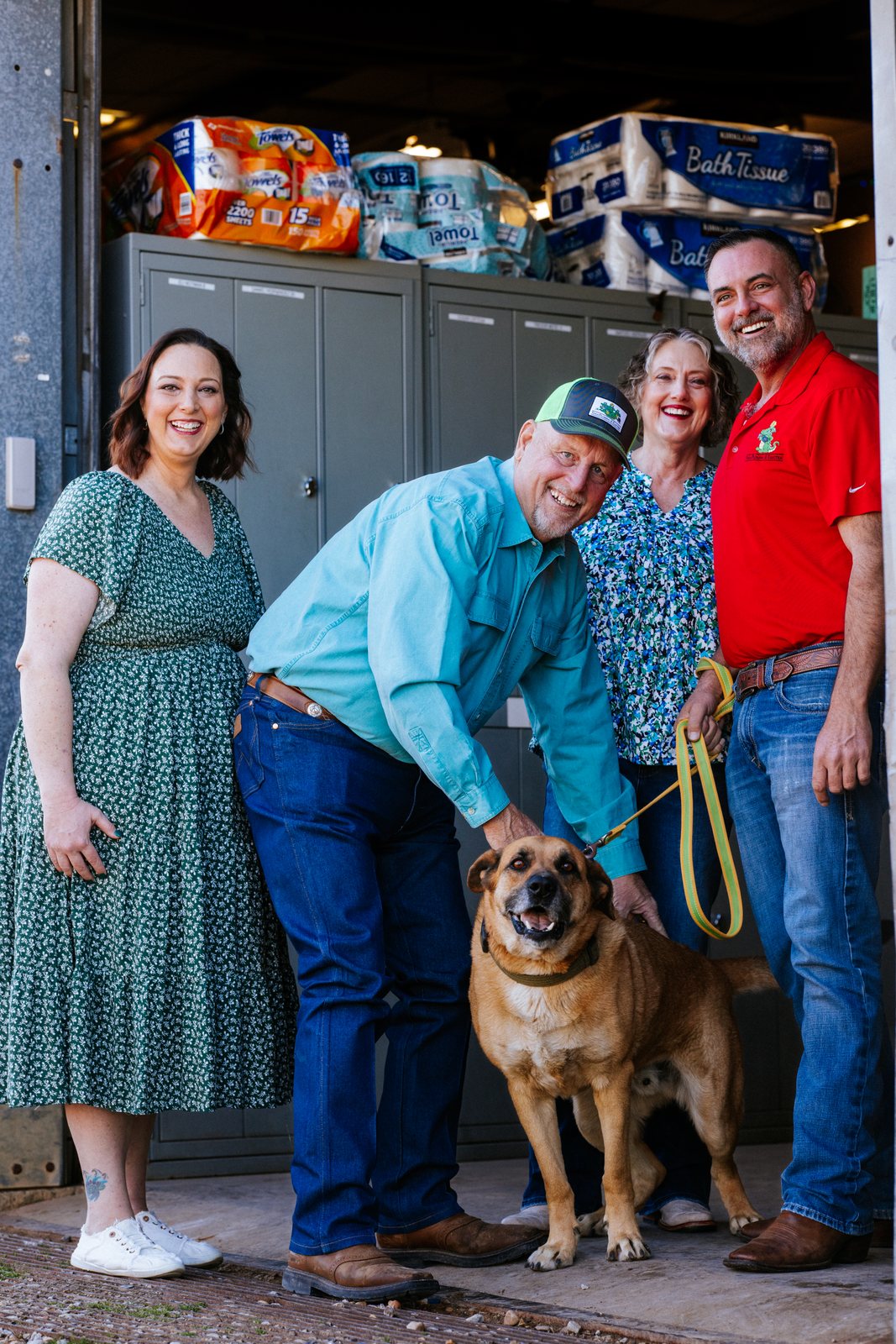 Tioga Plumbing leadership with the shop dog at the Hurst warehouse