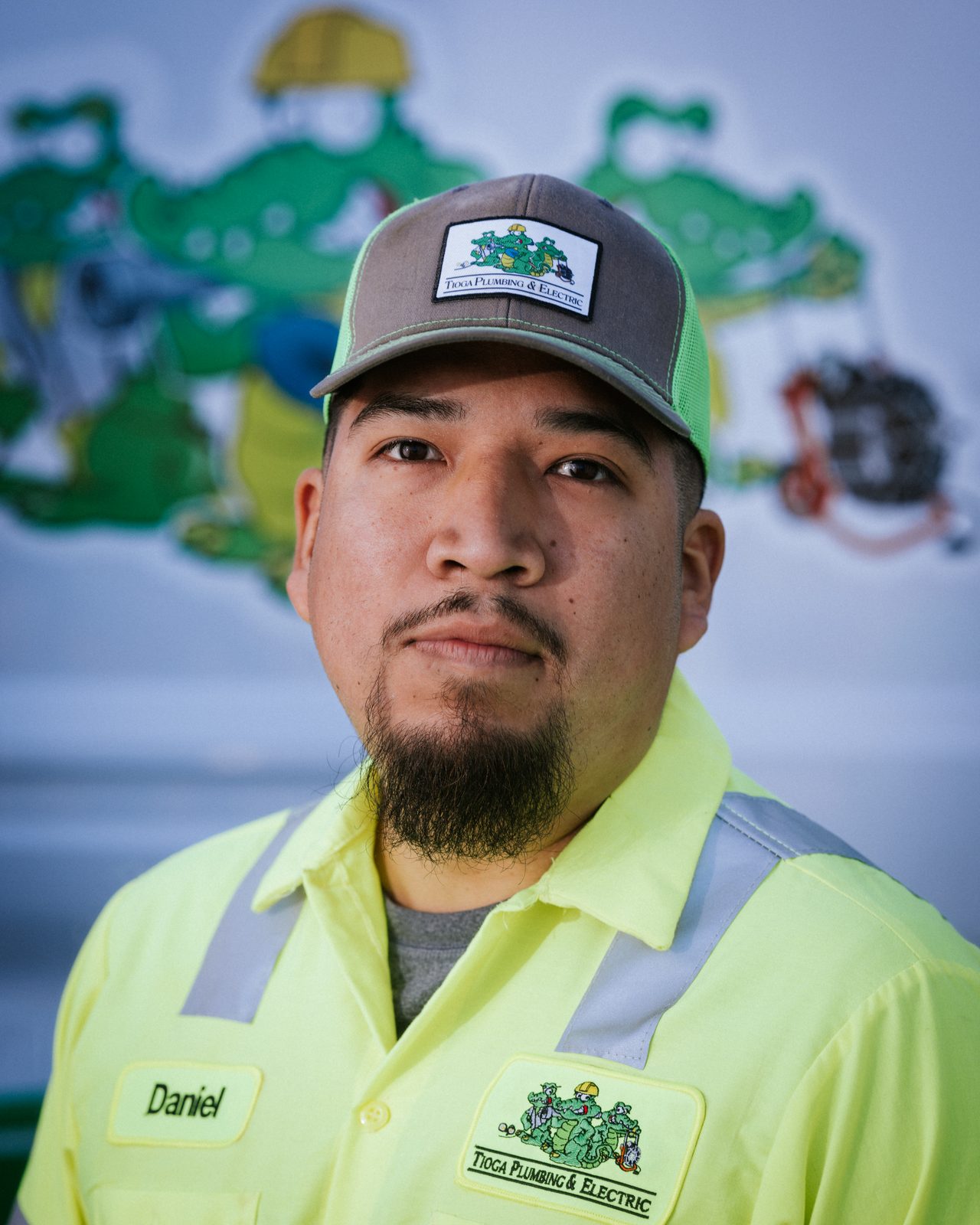 Tioga Plumbing technician Daniel, portrait in front of the gator van