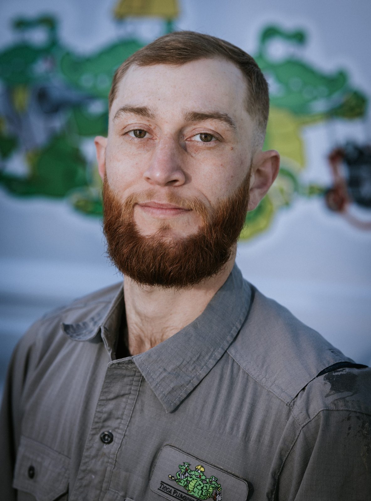 Tioga Plumbing technician portrait in front of the gator van
