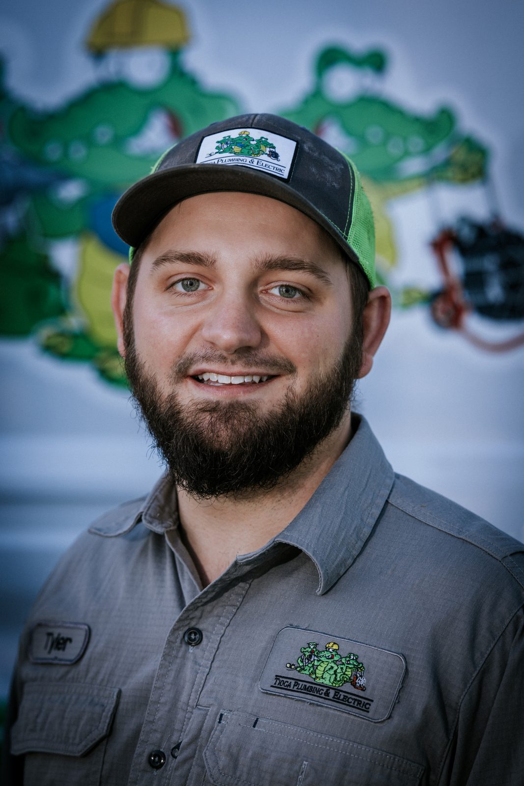 Tioga Plumbing technician portrait in front of the gator van