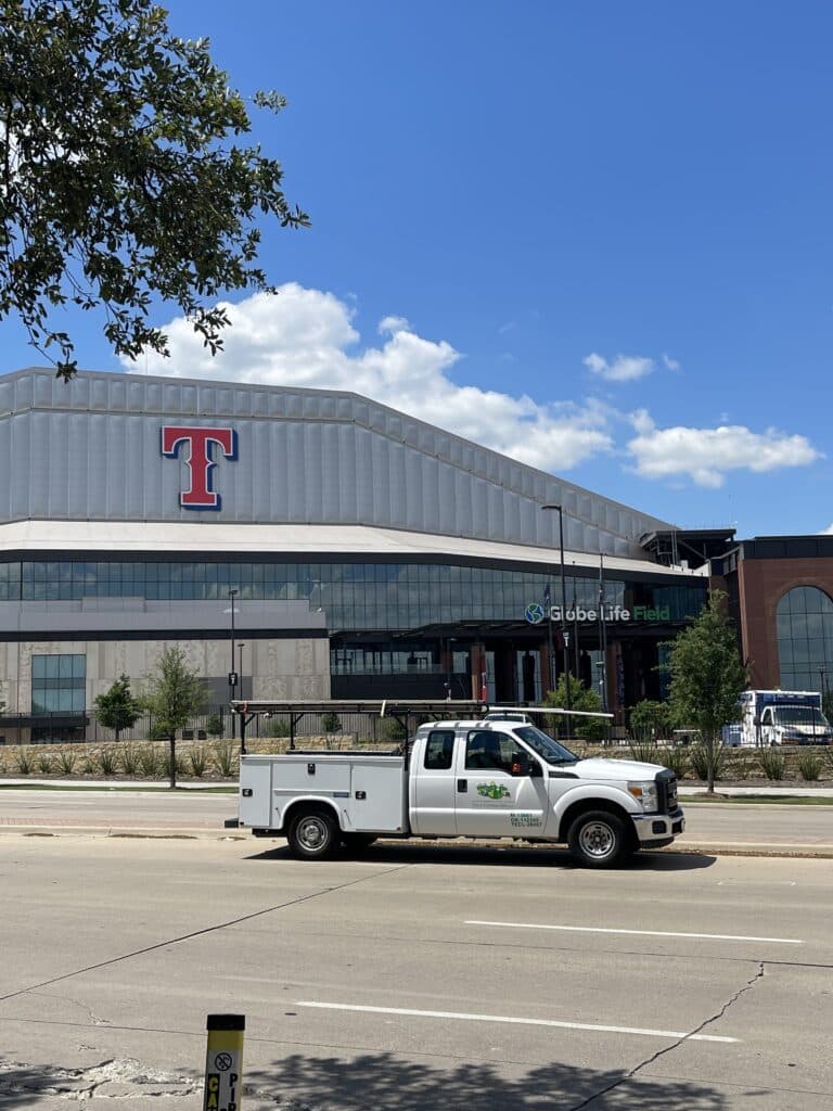 The Globe Life Field building and a Tioga service truck in Arlington Texas
