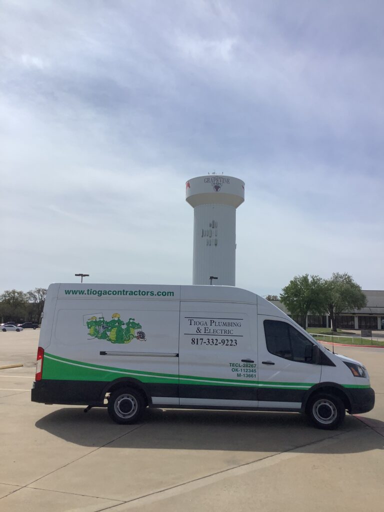 The Grapevine water tower and Tioga Plumbing & Drain service van in Grapevine Texas
