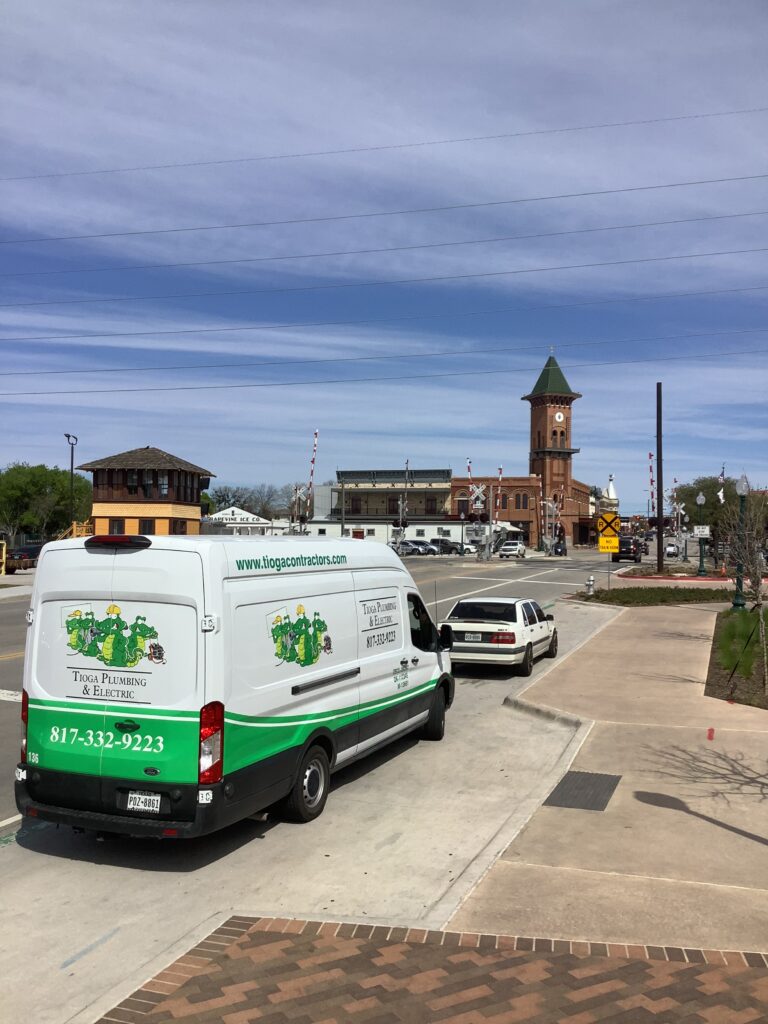 The Tioga Plumbing & Drain service van in Downtown Grapevine Texas