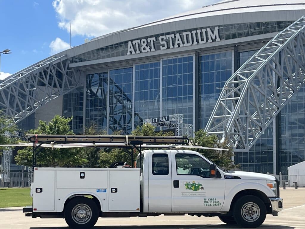 The Tioga Plumbing & Electric parked outside the AT&T Stadium in Arlington Texas