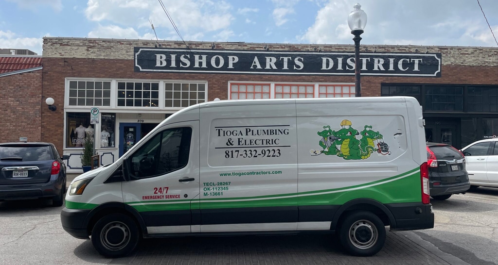 Tioga Plumbing & Electric van parked in Dallas, TX in front of the Bishop Arts Distict