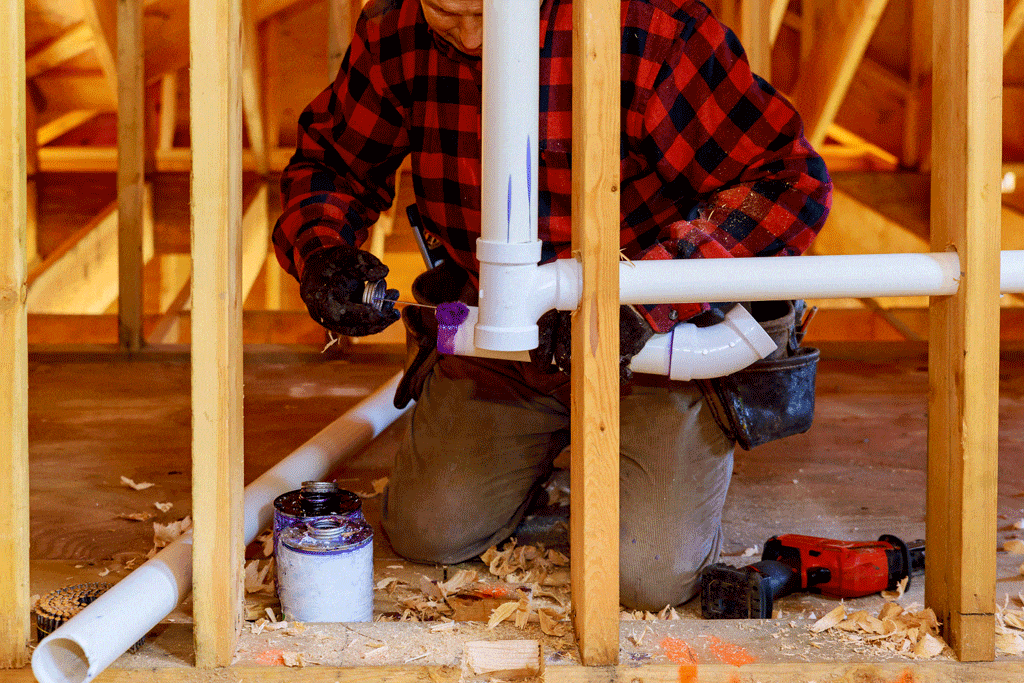 man plumber putting in pipes | water line repair bedford tx hurst tx arlington tx 